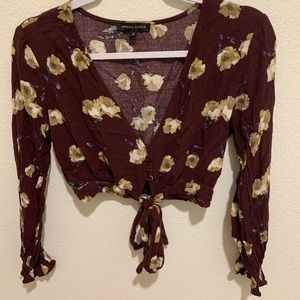 A floral tie in the front blouse